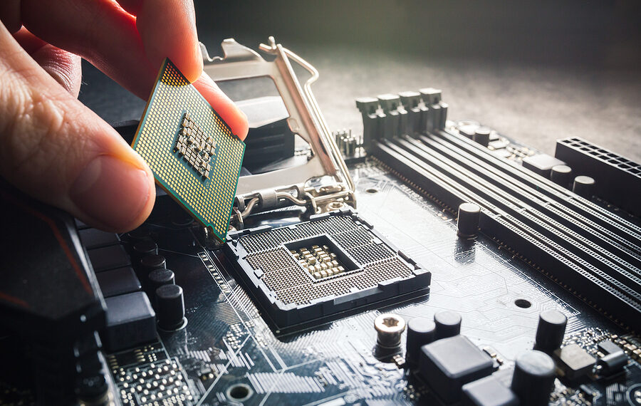 Electronic engineer of computer technology. Maintenance computer cpu hardware upgrade of motherboard component. Pc repair, technician and industry support concept. Close up photo.